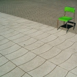 green chair outside a trade show exhibition
