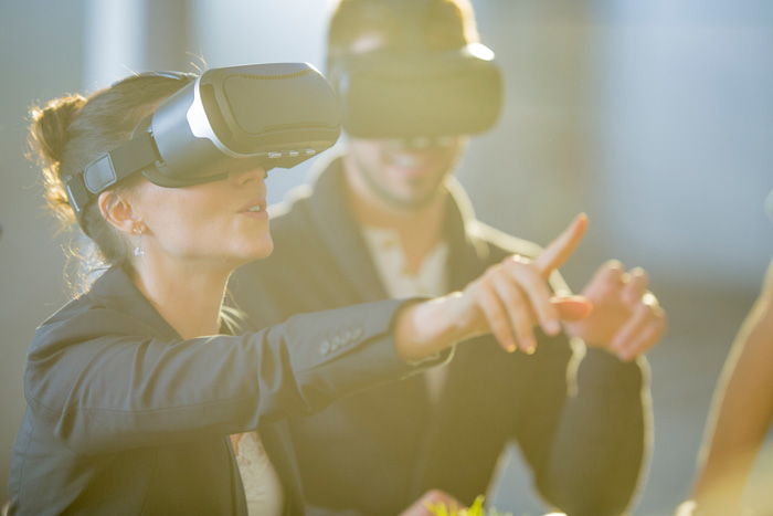 image of people using virtual reality to entice trade show attendees